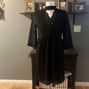 Black lace dress with see through sleeves.Very elegant dress. Dress it down also